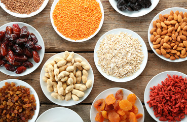 Raw diet food on wooden background, top view