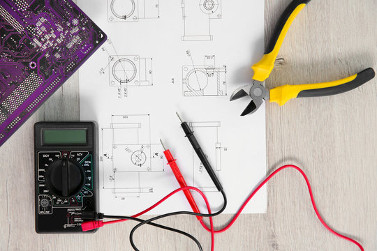 Project drawing and digital multimeter top view
