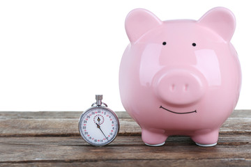White piggy bank and a timer on white background