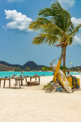 Tropical beach at Antigua island in Caribbean with white sand, t