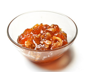 Sweet white cherries jam in the transparent glass bowl with lemo
