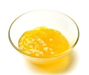 Sweet pineapple jam in the transparent glass bowl