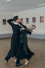 Professional dancers dancing in ballroom