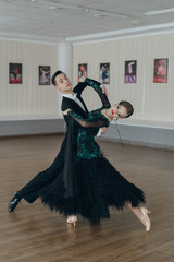 Professional dancers dancing in ballroom
