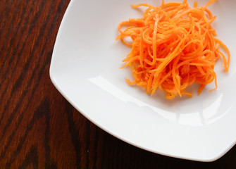 grated orange julienne fresh carrots on the plate