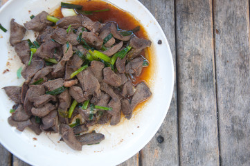 Stir fried pork liver on white plate. Homemade Idea of asian cui