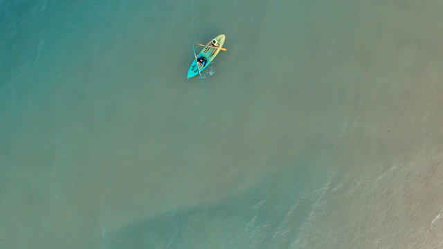 aerial view of people kayaking over sea water