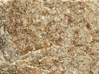 Dark brown stone with cracks on the surface