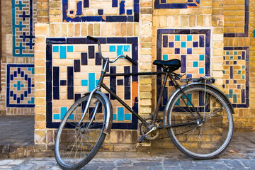 Old bicycle on old street of Bukhara, Uzbekistan © allenkayaa