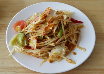 Spicy papaya salad with salted eggs in Thai style