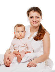 happy family mother baby under blankets bed