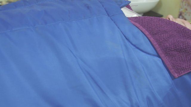 Close up of fat adult woman lie in professional saloon, covered by thermal blanket. Spa wrapping