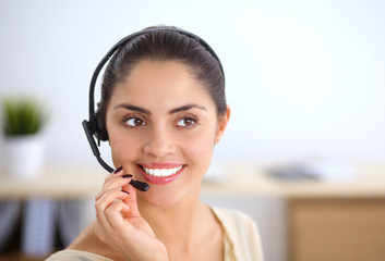 Close-up portrait of a customer service agent sitting at office