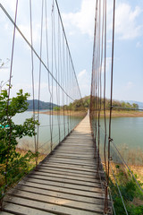Rope bridge across the river to island