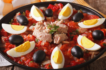 Arabic cuisine: tuna salad with vegetables and eggs close-up. horizontal
