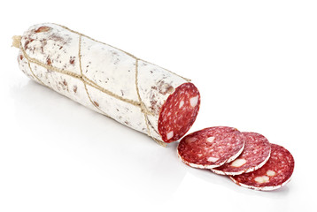 Dried salami with white mold isolated on white background.