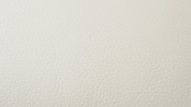 White rough leather texture close-up tilting 4K 2160p UltraHD footage - Slow tilt over light beige leather texture 4K 3840X2160 UHD video 