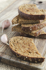 Toasted rye bread on a wooden board. Rustic style.