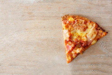 pizza slice on wood
