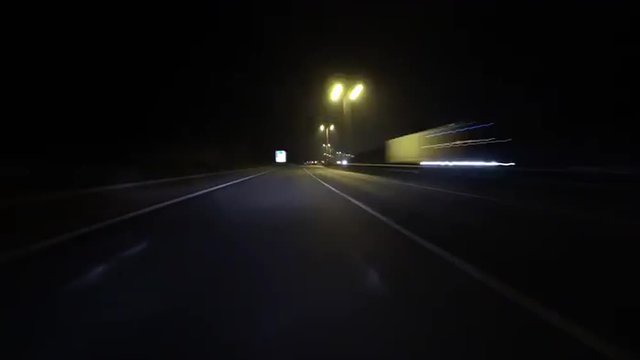 Time-lapse of driving on the Northamptonshire A14 dual carriageway road through roadworks at night.