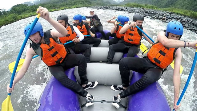 Experience the thrill of whitewater rafting with our team of nine people,captured on camera for an unforgettable adventure.