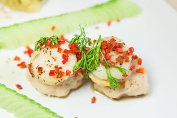 Scallop sprinkled with chili chopped and coriander