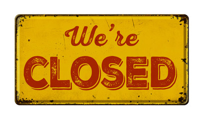 Vintage rusty metal sign on a white background - We are closed