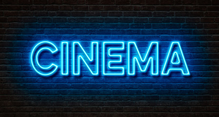 Neon sign on a brick wall - Cinema