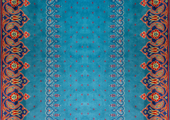  Abstract blue  pattern with leaves and pale red floral features on carpet