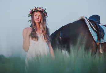 portrait of a pretty young woman with browne horse - 106468549