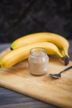 Children's meal of mashed banana in a glass jar