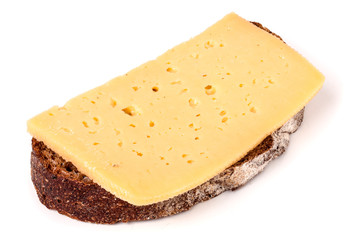 Bread with butter and sliced cheese on white background