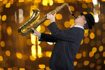 Saxophonist. Man playing on saxophone