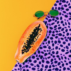 Jungle funny mix. Papaya and fashionable sunglasses.