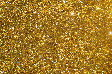 Abstract background with glittering golden particles