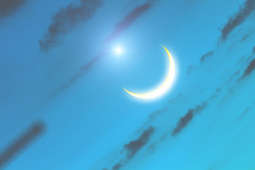 Obraz na płótnie Canvas Moon and stars on a blue sky background.