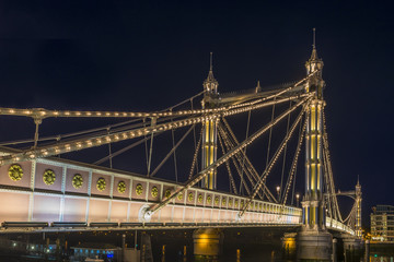 Illuminated Albert bridge in west London at night