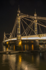 Illuminated Albert bridge in west London at night