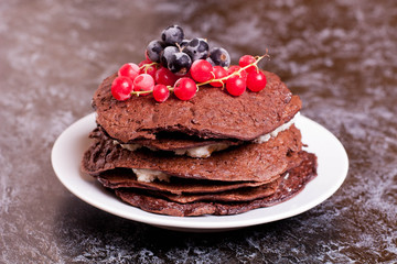 Chocolate pancake with currant