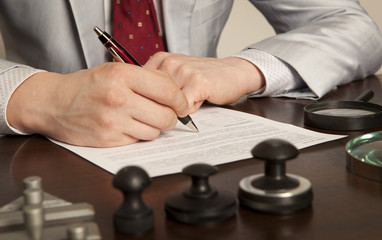 Notary signs the documents from our office