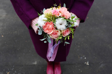 Beautiful children's bouquet in female hands