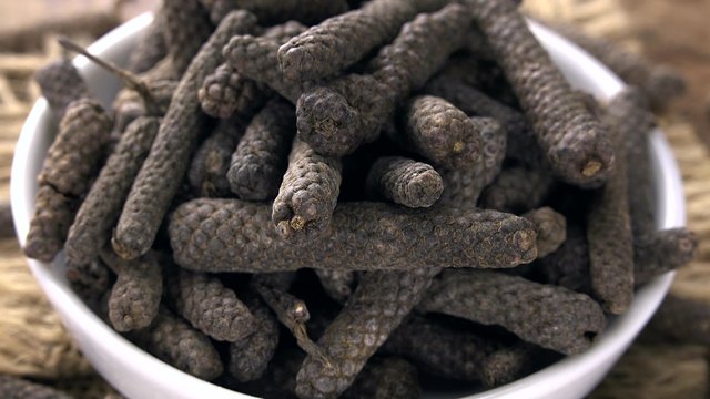 Rotating Long Pepper as not loopable 4KUHD footage