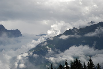 Fog in mountain range in the Swiss alps