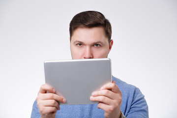 young male using digital tablet 