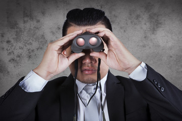 business man looking through binocular lens use for business str