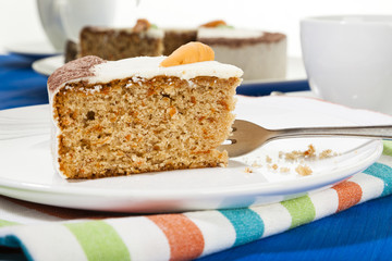 Piece of carrot cake on coffee table