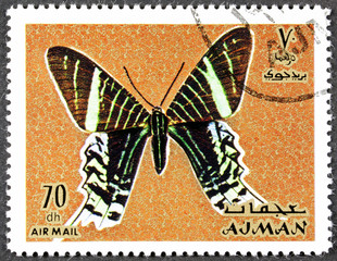 AJMAN - CIRCA 1971: A stamp printed in Ajman shows a butterfly, circa 1971.