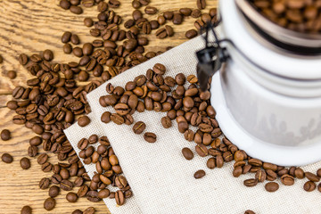 Vintage coffee grinder mill with coffee beans.