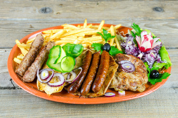 Mixed grilled meats on a plate