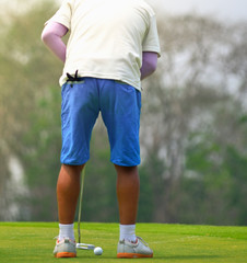 Man playing golf